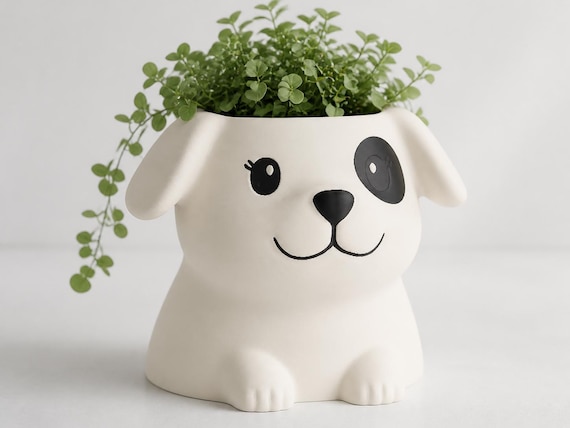 Three-quarter close-up of the Cream Coat PawBloom planter with the Wide-Eyed Patch expression
