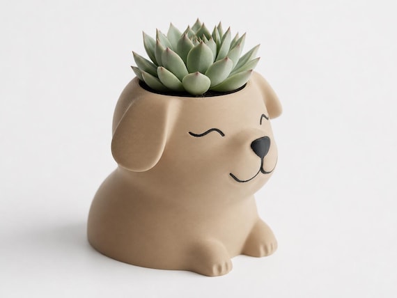 Elevated side close-up of the Biscuit Coat dog planter showing its ear profile and planting opening