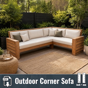 May include: An L-shaped outdoor corner sofa constructed from light brown wood slats, featuring thick off-white seat cushions and back cushions. The sofa includes several decorative throw pillows in solid olive green and light beige colors.