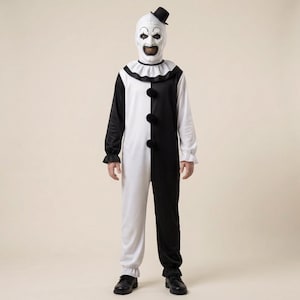 May include: A full-body clown costume featuring a black and white colour-blocked jumpsuit with three black pom-poms down the front, a ruffled collar, and a matching white mask with a small black top hat attached to the top of the head.