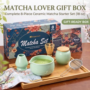 May include: An 8-piece matcha starter set featuring a light green ceramic bowl, a whisk holder, a lidded canister, a bamboo whisk, a metal strainer, and a wooden scoop on a bamboo tray, with a box labeled Matcha Lover Gift Box.
