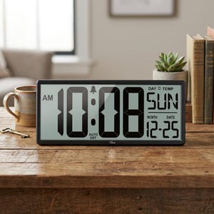 May include: A rectangular digital wall clock with a black frame and a large LCD screen displaying the time 10:08 AM, the day SUN, and the date 12-25. The screen also features indicators for an alarm, auto DST, day, and temperature settings.