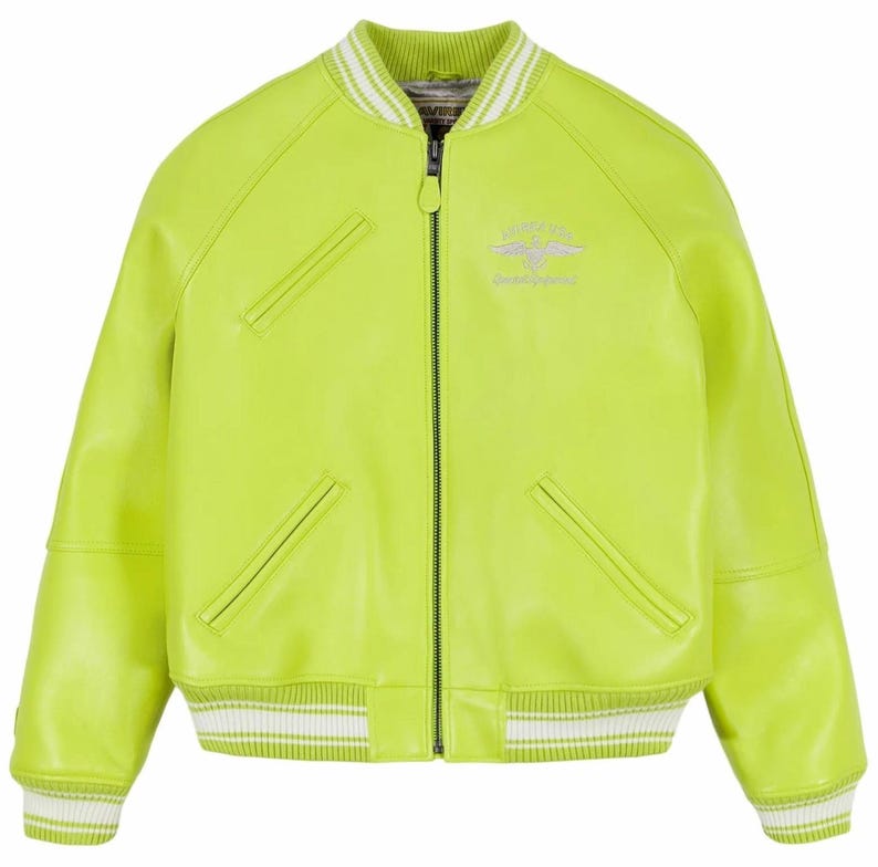 May include: A bright lime green bomber jacket featuring a front zipper closure, two slanted welt pockets, and a single chest pocket. The collar, cuffs, and hem are finished with white and green striped ribbed trim. A small silver logo is on the chest.