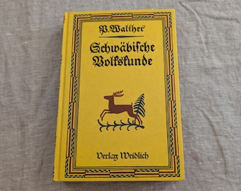 Pode incluir: Um livro de capa dura amarelo intitulado Schwäbische Volkskunde de P. Walther, publicado pela Verlag Weidlich. A capa apresenta um gráfico de um cervo castanho, um pinheiro verde e uma borda decorativa preta em tipografia gótica.
