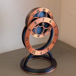 Hoops: Unique Gear-Driven Art Clock • Patent-pending rotating dials bring a mesmerizing, 3D-printed conversation piece to life.
