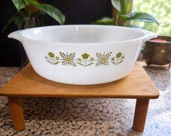 Anchor Hocking Fire-King milk glass casserole dish in the "Meadow Green" pattern.