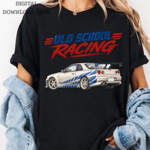 May include: Black t-shirt featuring a white and blue race car graphic. The text "OLD SCHOOL RACING" is above the car in red and blue. The words "DIGITAL DOWNLOAD ONLY" are in the top left corner.