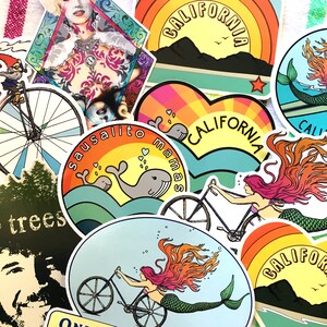 May include: Assortment of colorful stickers featuring various designs, including a mermaid, a bicycle, a whale, and the text "California".