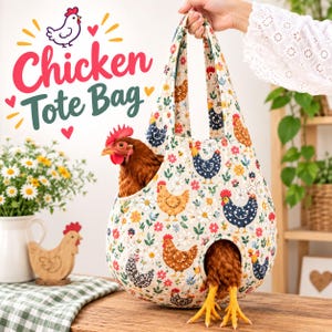 May include: A fabric tote bag featuring a repeating pattern of chickens and flowers on a cream background. The bag has a rounded shape with two handles and contains a live brown chicken with its head and feet protruding from the openings.