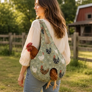 May include: A sage green fabric sling bag featuring a repeating pattern of various chickens and small white flowers. The bag has an open top and a circular cutout at the bottom, with a brown chicken visible inside and its legs extending out.