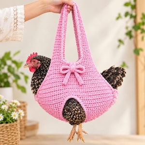 May include: A pink crocheted chicken harness featuring a decorative bow on the front and two shoulder straps. The harness is designed to hold a black and brown speckled chicken, with openings for the legs and tail to extend through the bottom and back.