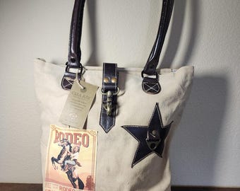 Bolso de lona Clea Ray Rodeo State Fair, confeccionado con materiales reciclados.