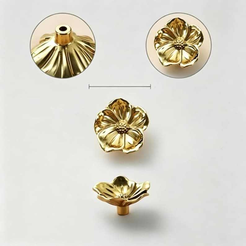 May include: Gold-colored flower-shaped cabinet knobs. The knobs have a detailed petal design and a central, textured core. The hardware is shown in multiple views, including a close-up of the knob's base and a top-down view.