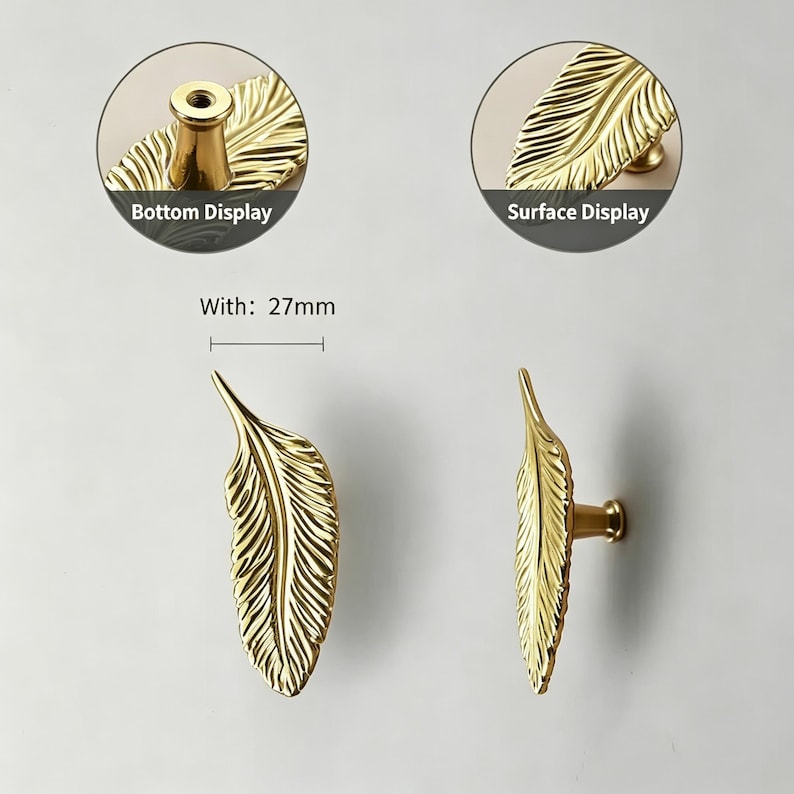 May include: Gold-colored feather-shaped cabinet pulls. The pulls are 27mm wide and feature detailed feather vein patterns. The image includes close-up views of the bottom and surface displays of the hardware.