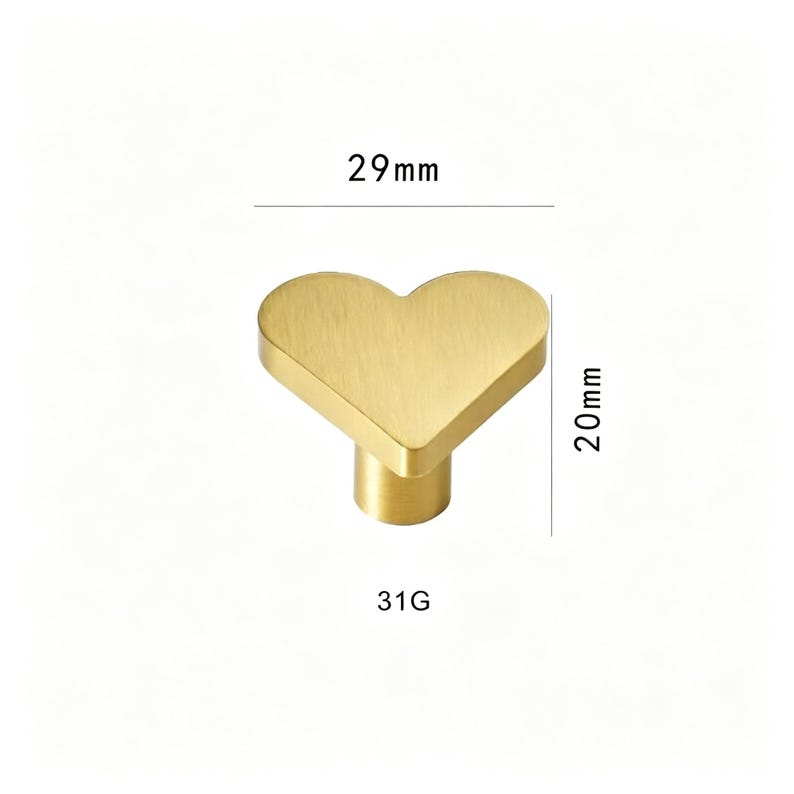 May include: A heart-shaped cabinet knob in a brushed gold finish. The knob measures 29mm wide and 20mm tall. The text "31G" is printed below the knob.