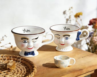 Handmade Retro Face Ceramic Mug, Winking Coffee Cup with Bow Detail