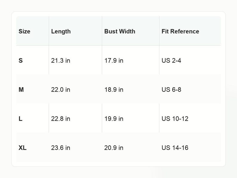 May include: A white sizing chart table with black text listing sizes S, M, L, and XL. Columns include Length and Bust Width in inches, and a Fit Reference column with US sizes 2-4, 6-8, 10-12, and 14-16. The table provides specific measurements for each size.