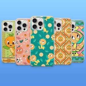 May include: A collection of five phone cases featuring the Orange Bird character. Designs include the Orange Bird with leaves, floral patterns, and geometric designs. The cases are in various colors, including green, orange, and pink. The Walt Disney logo is visible on one case.
