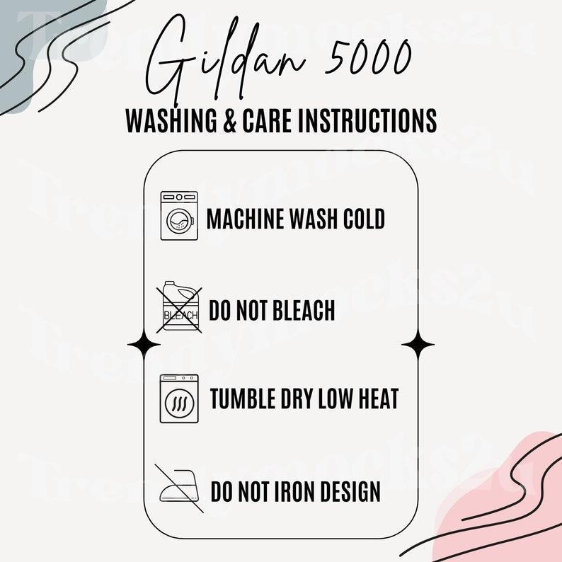 May include: A graphic displaying washing and care instructions for a Gildan 5000 garment. The instructions are: machine wash cold, do not bleach, tumble dry low heat, and do not iron design. The background is light with decorative elements.