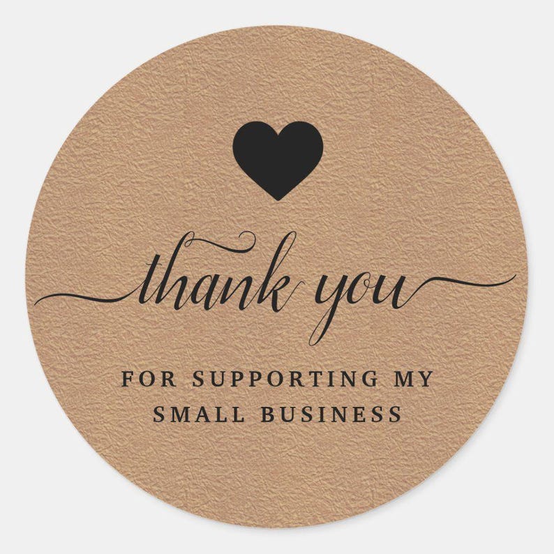 May include: Circular sticker with a textured, tan background. A black heart sits at the top, with the words "thank you" in cursive script. Beneath, it reads "FOR SUPPORTING MY SMALL BUSINESS" in a sans-serif font.
