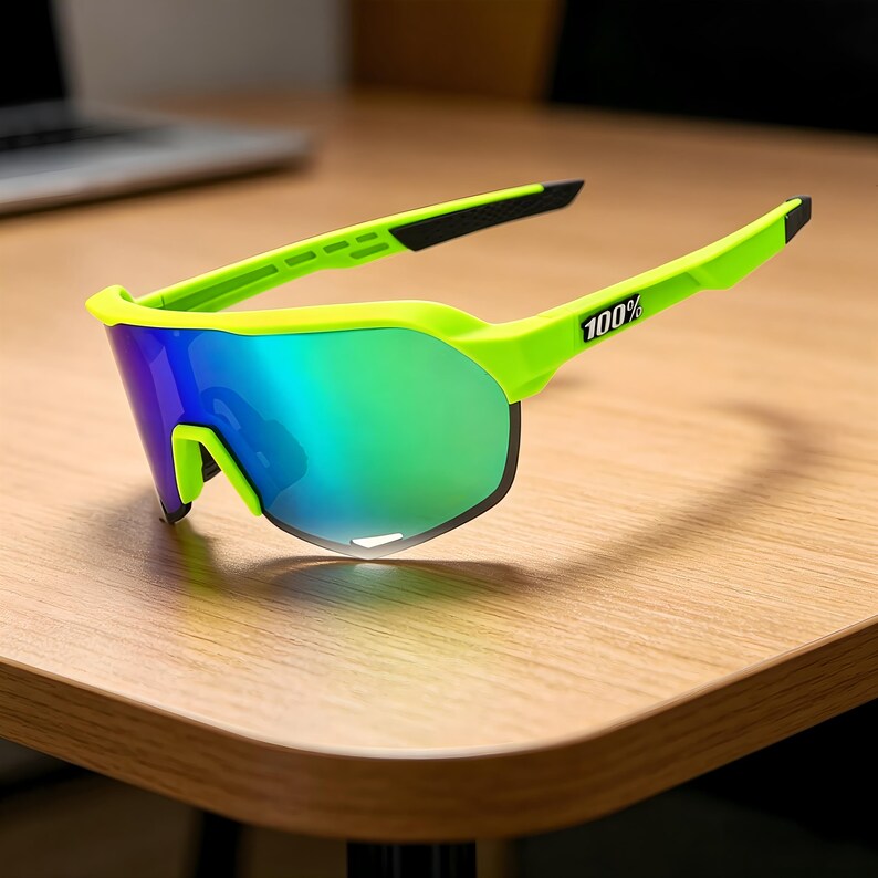 May include: Neon green sports sunglasses with a mirrored lens that reflects blue and green hues. The frame has a sleek, modern design with the text "100%" printed on the temple. The sunglasses are designed for outdoor activities.