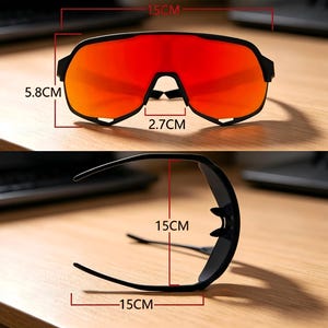 May include: Black sports sunglasses with red lenses. The sunglasses measure 15 cm in width, 5.8 cm in height, and 2.7 cm at the bridge. The frame is black and the lenses are a vibrant red color.