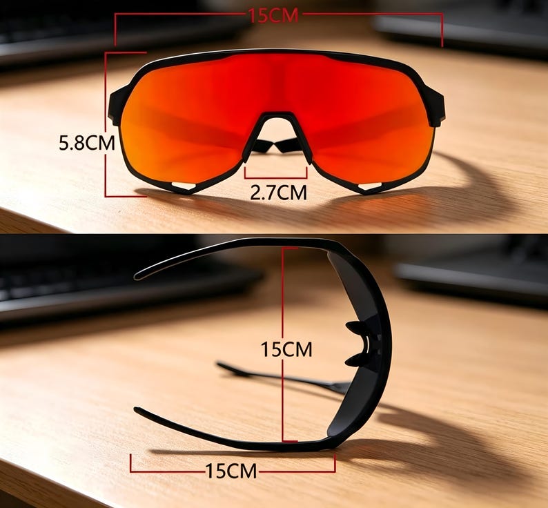 May include: Black sports sunglasses with red lenses. The sunglasses measure 15 cm in width, 5.8 cm in height, and 2.7 cm at the bridge. The frame is black and the lenses are a vibrant red color.