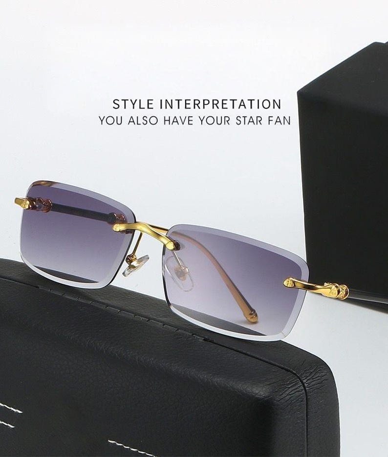 May include: Rimless sunglasses with gold-colored frames and gradient lenses. The lenses transition from a dark purple at the top to a lighter shade at the bottom. The text "STYLE INTERPRETATION YOU ALSO HAVE YOUR STAR FAN" is visible.