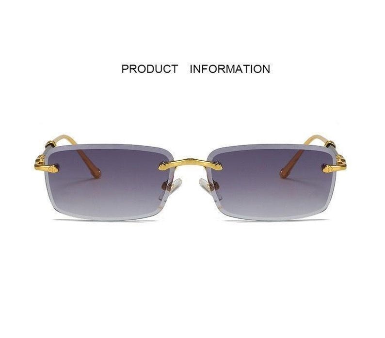 May include: Rimless sunglasses with a gradient lens. The rectangular lenses transition from a dark purple at the top to a lighter shade at the bottom. The frames are gold-colored, and the text "PRODUCT INFORMATION" is above the sunglasses.