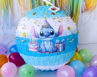 A bright piñata with a Blue Alien and cake