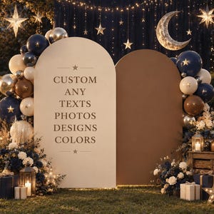 May include: Two arched display panels in cream and brown featuring the text CUSTOM ANY TEXTS PHOTOS DESIGNS COLORS. The setup is decorated with navy blue, cream, and metallic gold balloons, star ornaments, a crescent moon, and floral arrangements.