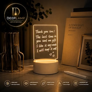 May include: A rectangular LED night light with a warm glow. The light features the text "Thank you son! The last time in you sent me gift I like it very much I will keep it well." The base is white.