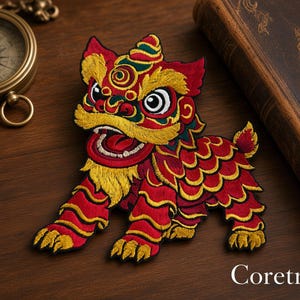 May include: An embroidered patch featuring a stylized lion creature with vibrant red, yellow, and green thread. The design includes a detailed face with wide eyes, a bared mouth, and a textured mane. The text Coretrims is visible in the corner.