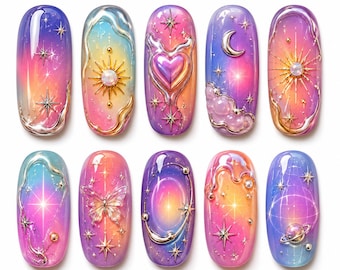 May include: A set of ten colorful nail art designs. Each nail features a gradient of colors, stars, and celestial-themed embellishments, including moons, suns, and planets. The designs incorporate silver and gold metallic accents.