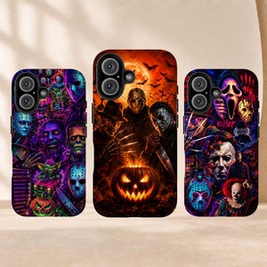 May include: Three smartphone cases featuring vibrant, detailed horror movie character illustrations. The designs include iconic figures like masked slashers, clowns, and monsters set against dark, fiery, and purple-toned backgrounds with pumpkins.