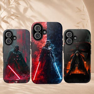 May include: Three rectangular phone cases featuring Star Wars character graphics. The left case shows a dark figure with a red lightsaber. The center case displays a split red and blue background with a character. The right case depicts a hooded figure.