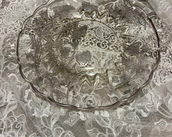 Vintage glass serving plate with silver poppy overlay.