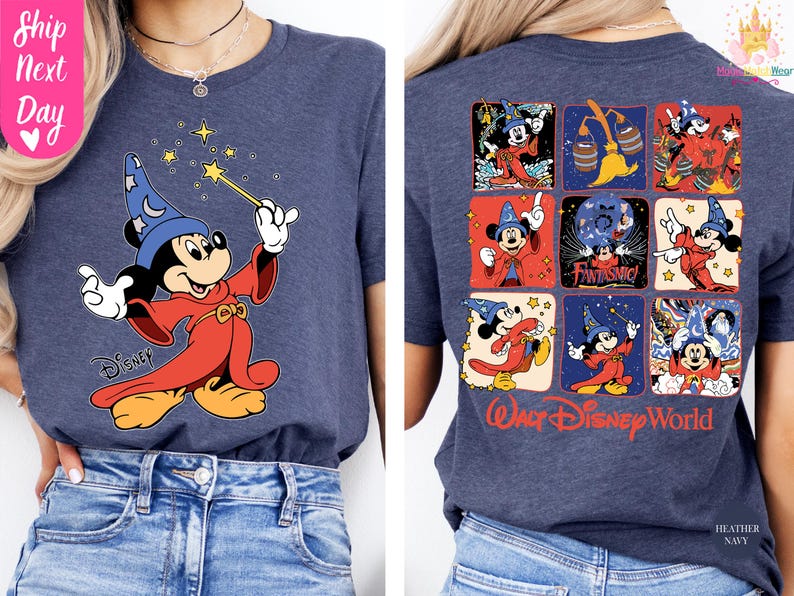 May include: Heather navy blue t-shirt featuring a graphic of Mickey Mouse as a sorcerer with a wand and stars. The back of the shirt displays Mickey Mouse in various poses with the words "Walt Disney World".