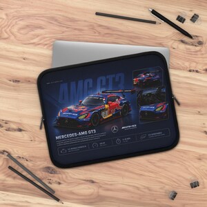 May include: A navy blue laptop sleeve featuring a Mercedes-AMG GT3 race car design. The sleeve displays the car's image, specifications, and the text "MERCEDES-AMG GT3". Additional images of the car are also shown.
