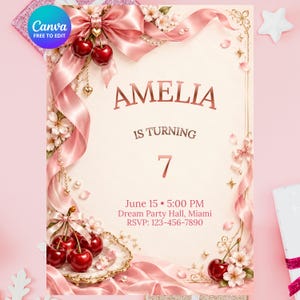 Op de afbeelding: Een rechthoekige verjaardagsuitnodigingskaart met een lichtroze achtergrond, versierd met glanzende rode kersen, roze satijnen linten, witte kersenbloesems en gouden accenten. De tekst luidt: AMELIA IS TURNING 7, June 15, 5:00 PM, Dream Party Hall, Miami, RSVP: 123-456-7890.