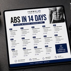 May include: A digital tablet displays a 14-day abs workout plan with the text "ABS IN 14 DAYS." The plan includes exercises like crunches, planks, and leg raises. Dumbbells and a black towel are in the background.