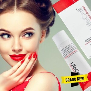 May include: A woman with red lipstick and nails holds her hand near her face. A white tube and a red and white box of LifeCell skincare products are in the background. The tube reads "ALL-IN-ONE ANTI-AGING TREATMENT". A yellow banner says "BRAND NEW".