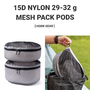 以下が含まれることがあります： HODR GEAR製15Dナイロンメッシュパックポッド、重量29-32グラム。グレーとブラックの円形収納ケースで、ジッパー開閉式。半透明のメッシュトップパネルを備えており、バックパック内のギアを整理するために使用されます。