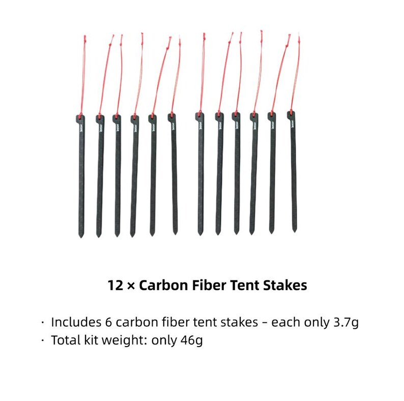May include: Twelve black carbon fiber tent stakes arranged in a row, each featuring a thin red pull cord attached to the top. The text below reads 12 x Carbon Fiber Tent Stakes, Includes 6 carbon fiber tent stakes - each only 3.7g, Total kit weight: only 46g.