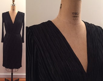 Gorgeous 1960s permanently pleated silk ls v neck dress with hand finishing