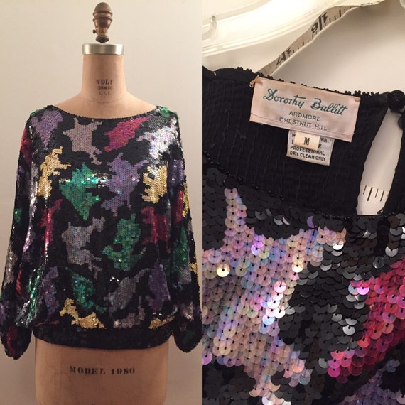 Abstract sequin knit banded batwing evening top