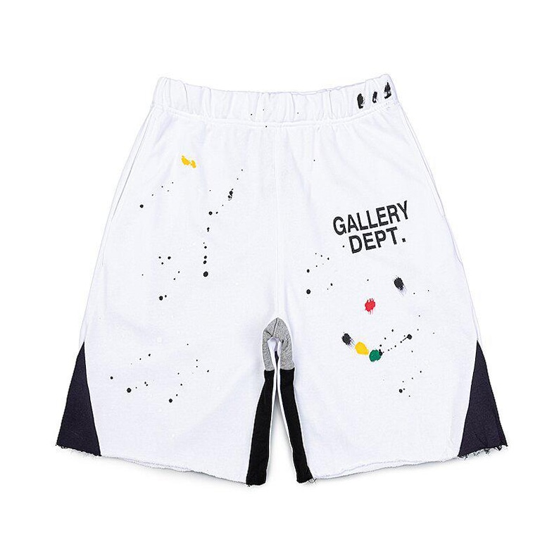 May include: White athletic shorts with black and coloured paint splatters. The shorts have black accents on the sides and the text "GALLERY DEPT." printed on the right leg. The shorts have an elastic waistband.