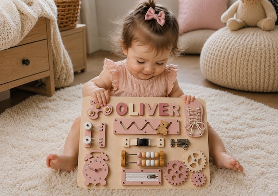 A Montessori busy board combined with a name puzzle — sensory activity toy AND personalized keepsake in one, which is genuinely clever product design for babies.