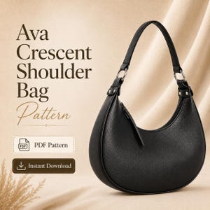 May include: A black crescent-shaped shoulder bag with a single strap attached by silver-tone metal rings. The text reads Ava Crescent Shoulder Bag Pattern, PDF Pattern, and Instant Download. The bag has a smooth texture and a zip closure.