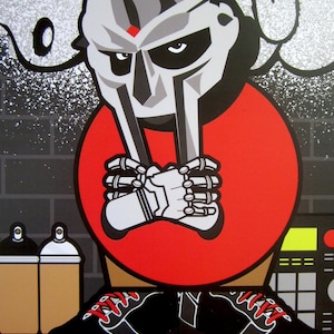 May include: A cartoon illustration of a masked figure wearing a red shirt and black shoes. The figure has a large, silver mask with a red dot on the forehead. The figure is standing in front of a graffiti-covered wall.